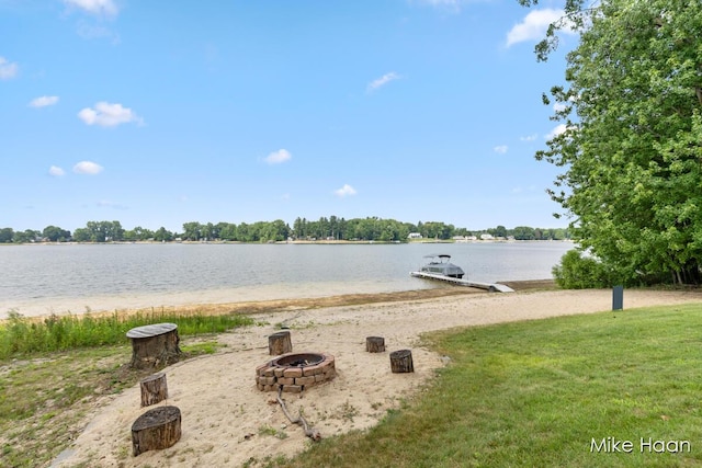 13545 Armitage Dr, Coral, MI 49322 - water view with an outdoor fire pit and a dock