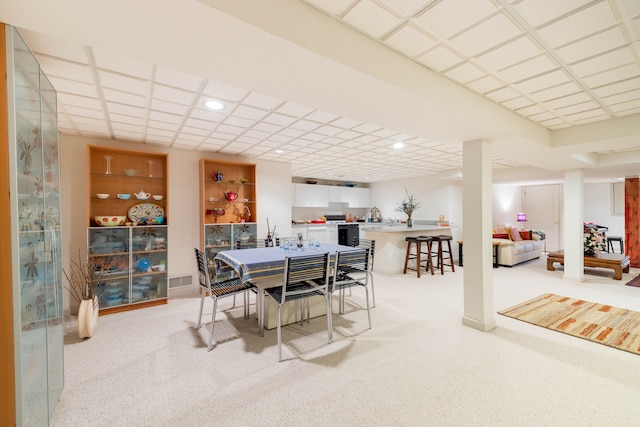 dining space featuring recessed lighting and light carpet
