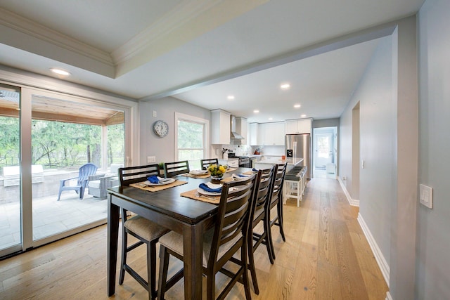 dining space featuring baseboards, recessed lighting, light wood-style flooring, and crown molding
