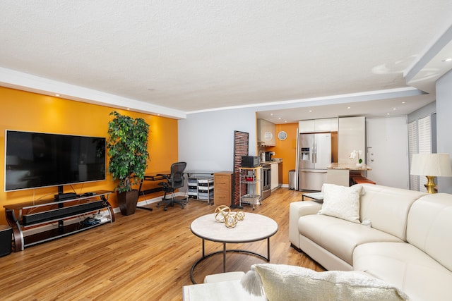 living room featuring light wood-style floors and recessed lighting