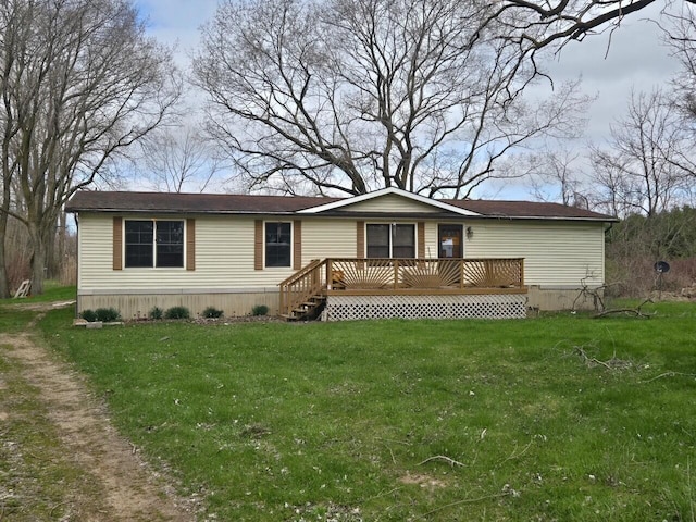 ranch-style house featuring a wooden deck and a front lawn