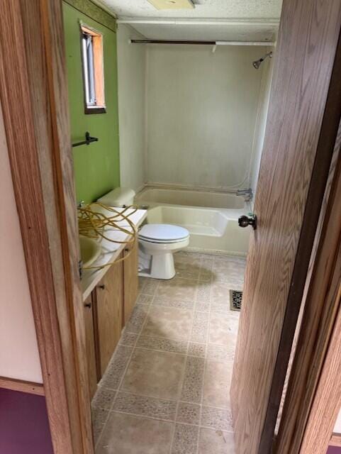 6201 N Lakeshore Rd, Deckerville, MI 48427 - bathroom featuring toilet, vanity, and shower / washtub combination