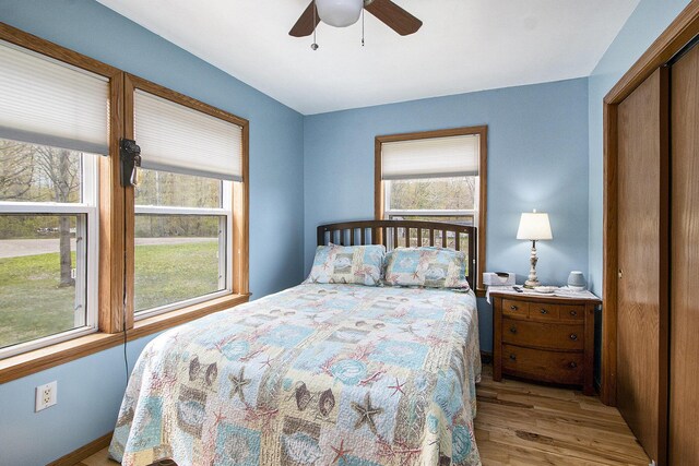 bedroom featuring ceiling fan and wood finished floors