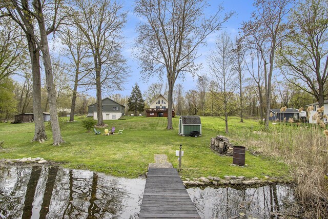 view of yard with a shed and an outbuilding