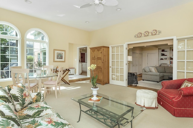 living area with recessed lighting, ceiling fan, french doors, and carpet flooring