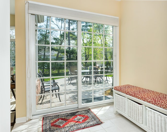 doorway with tile patterned floors