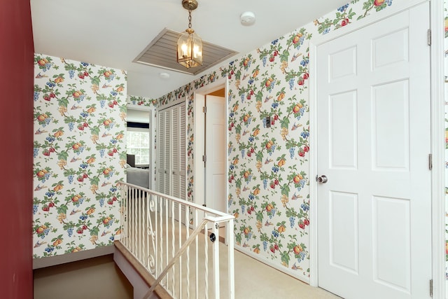 bathroom featuring baseboards and wallpapered walls