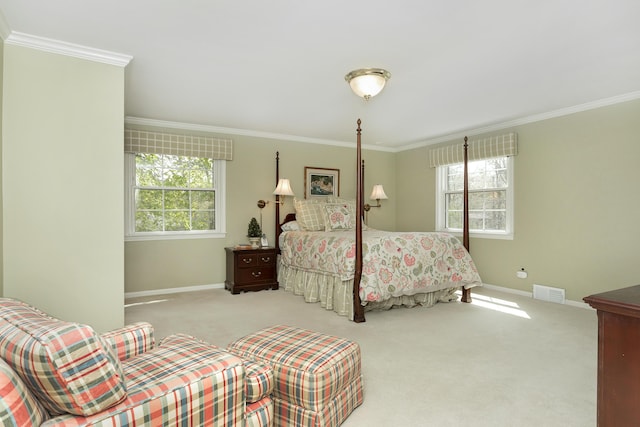 bedroom with crown molding, baseboards, visible vents, and carpet floors