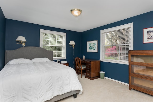 carpeted bedroom with baseboards