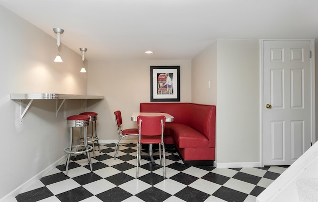 interior space featuring tile patterned floors, baseboards, and recessed lighting