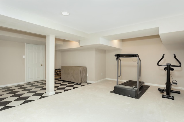 exercise room featuring recessed lighting, tile patterned floors, and baseboards