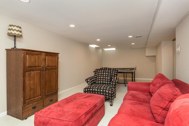 living area with baseboards, recessed lighting, and light colored carpet
