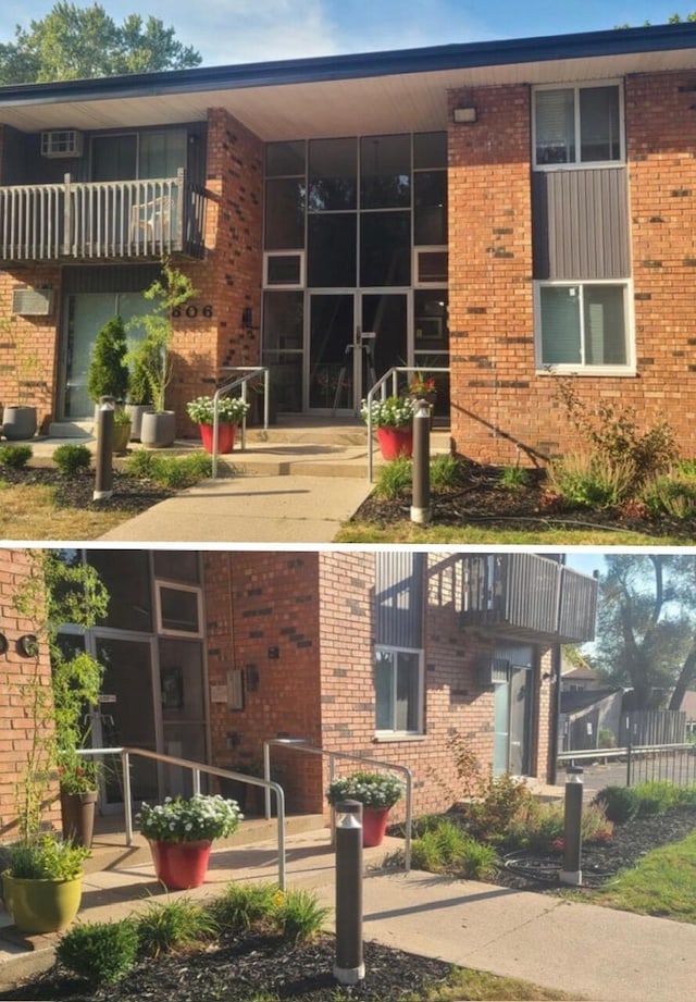 exterior space featuring a balcony and brick siding