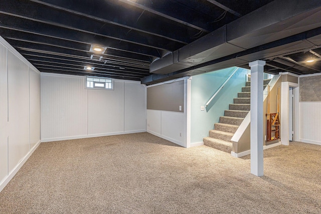below grade area featuring carpet floors and stairway