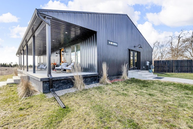exterior space with a lawn and fence