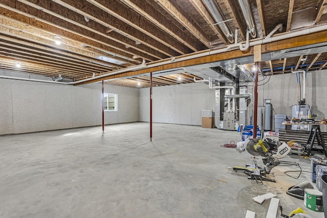 unfinished below grade area featuring heating unit