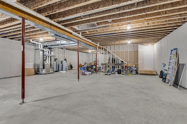 unfinished basement with heating unit and water heater