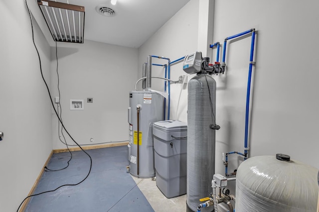 utilities with water heater and visible vents