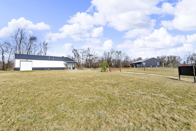 view of yard with a detached garage