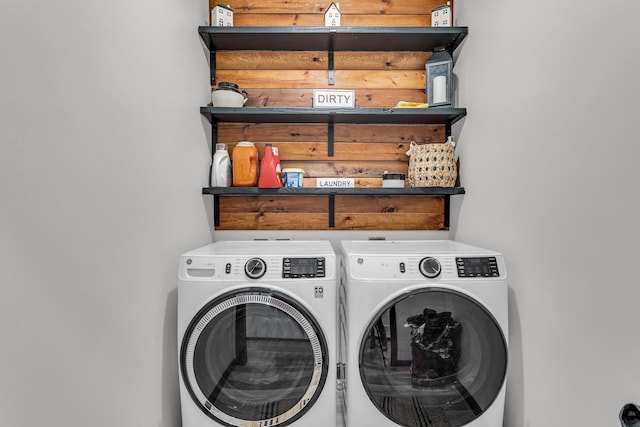 washroom featuring laundry area and washer and clothes dryer