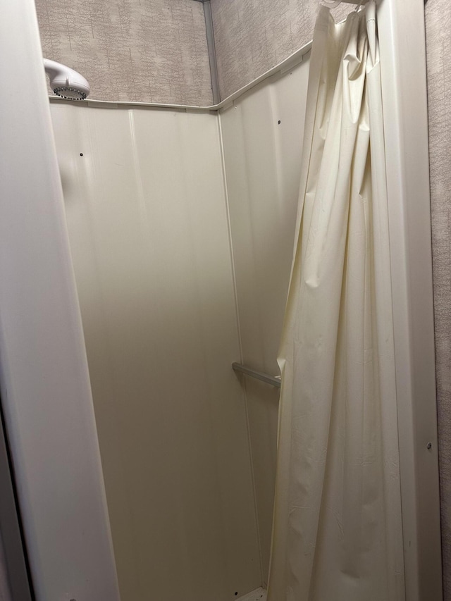 interior details featuring curtained shower