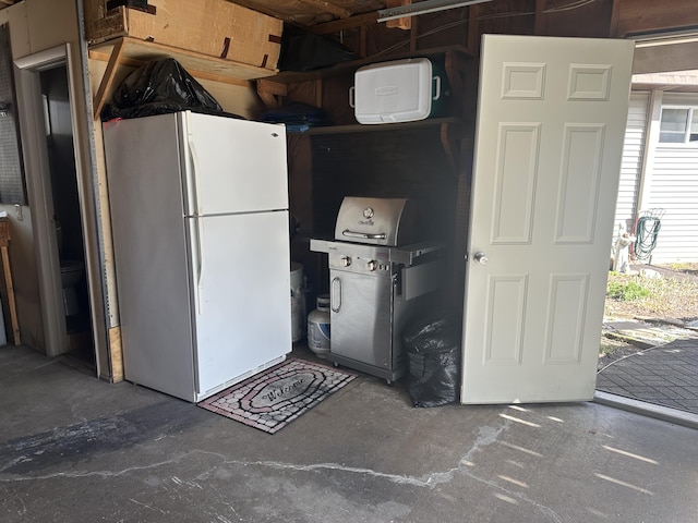 kitchen with freestanding refrigerator