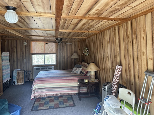 carpeted bedroom with wood ceiling and wooden walls