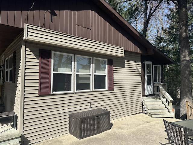 view of side of property featuring a patio