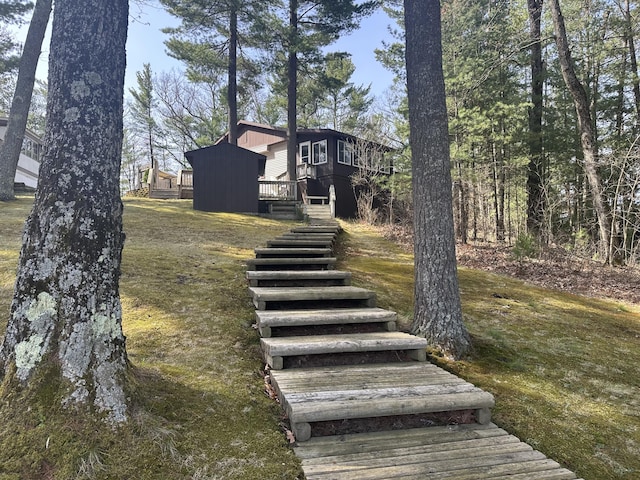 view of yard with stairway and a wooden deck