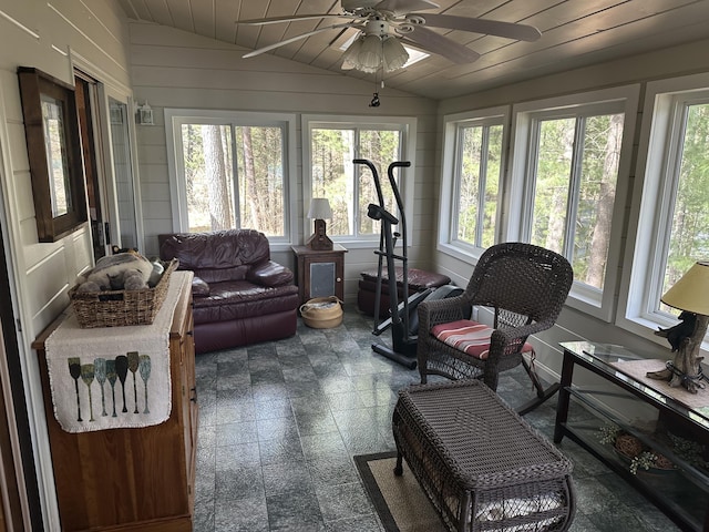 sunroom / solarium featuring vaulted ceiling and plenty of natural light