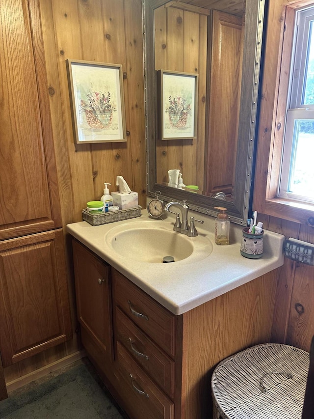 bathroom with wooden walls and vanity