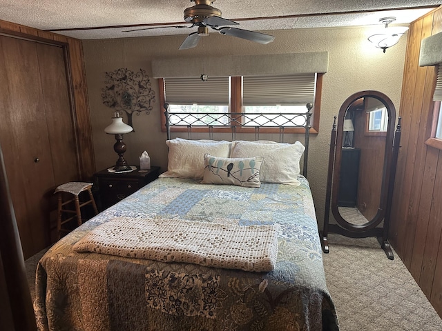 bedroom featuring a ceiling fan and a textured ceiling