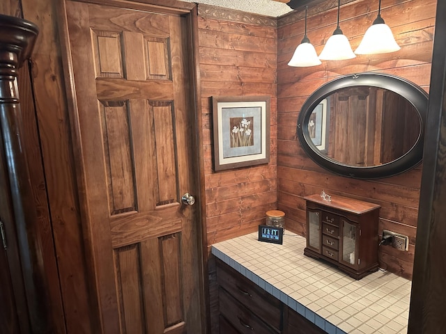 bathroom with wooden walls