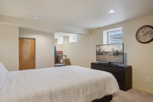 bedroom featuring light colored carpet, recessed lighting, and baseboards