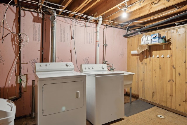washroom featuring washer and dryer, laundry area, and tile patterned floors