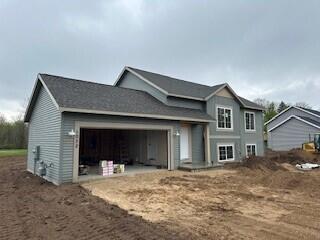 view of side of property with an attached garage
