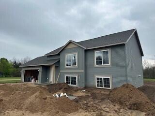 view of front of property featuring an attached garage