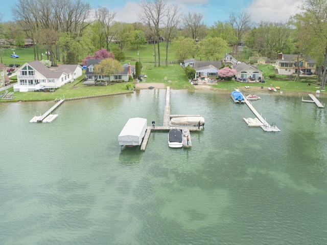 dock with a water view and view of scattered trees