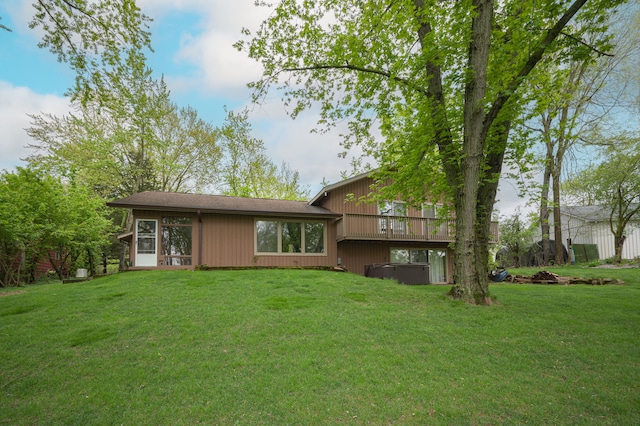 9550 Silverside, South Lyon, MI 48178 - back of house with a hot tub and a lawn