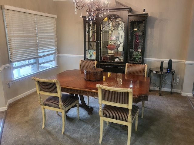 dining room featuring baseboards, carpet floors, and a notable chandelier