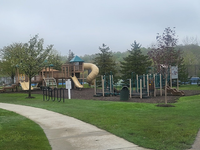 community jungle gym with a yard