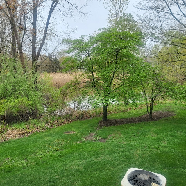view of yard with central air condition unit