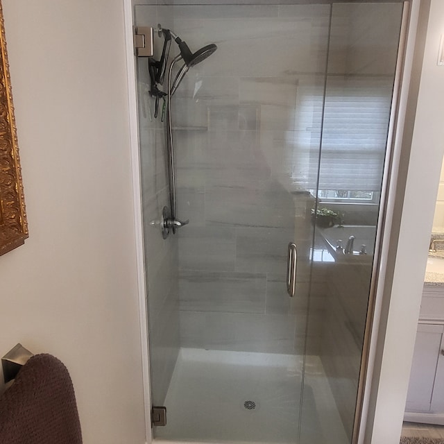 full bath with a shower stall