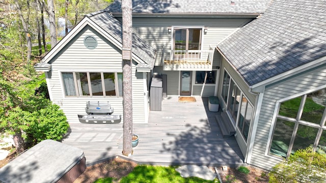 1151 Abseguami Trl, Lake Orion, MI 48362 - back of property with a deck and a shingled roof