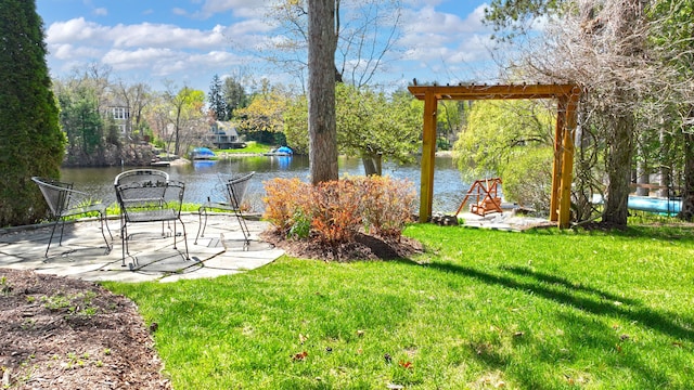 view of yard featuring a water view and a patio