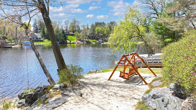 1151 Abseguami Trl, Lake Orion, MI 48362 - dock area featuring a water view and a playground