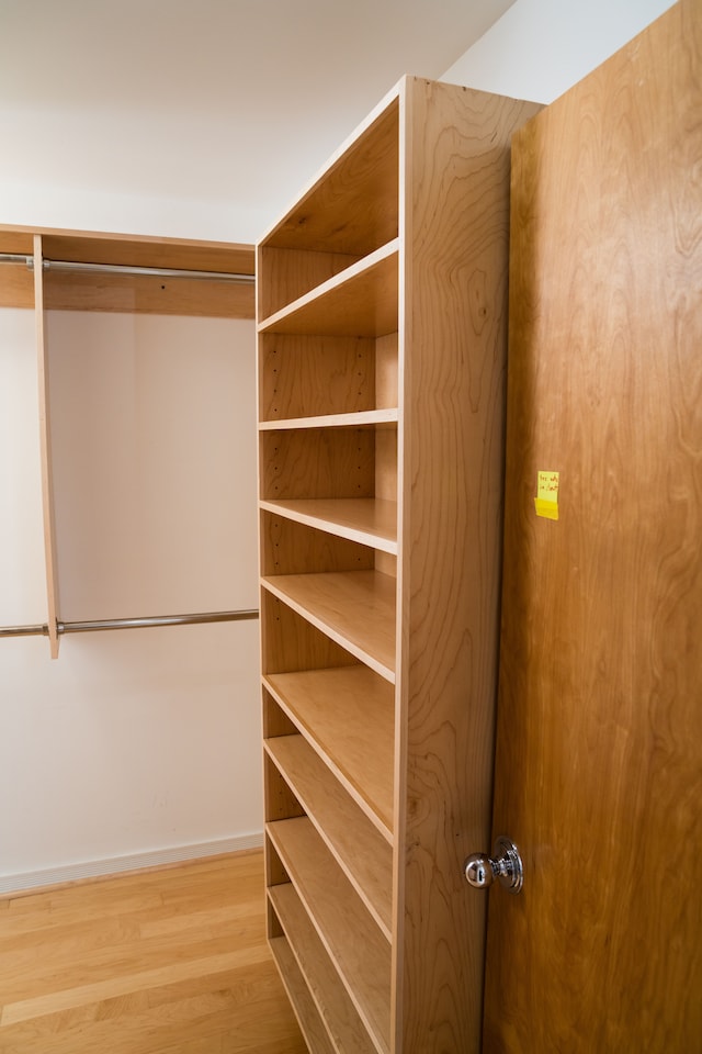 spacious closet featuring wood finished floors