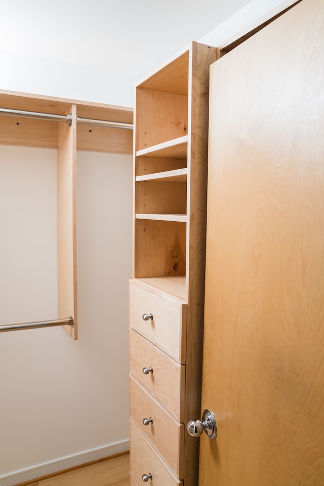 spacious closet with light wood-style floors