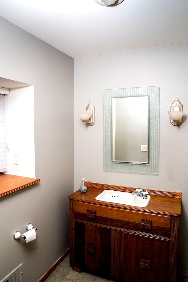 1151 Abseguami Trl, Lake Orion, MI 48362 - bathroom featuring vanity, baseboards, and tile patterned flooring