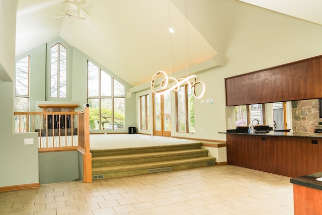 1151 Abseguami Trl, Lake Orion, MI 48362 - sunroom featuring french doors, vaulted ceiling, a sink, and plenty of natural light